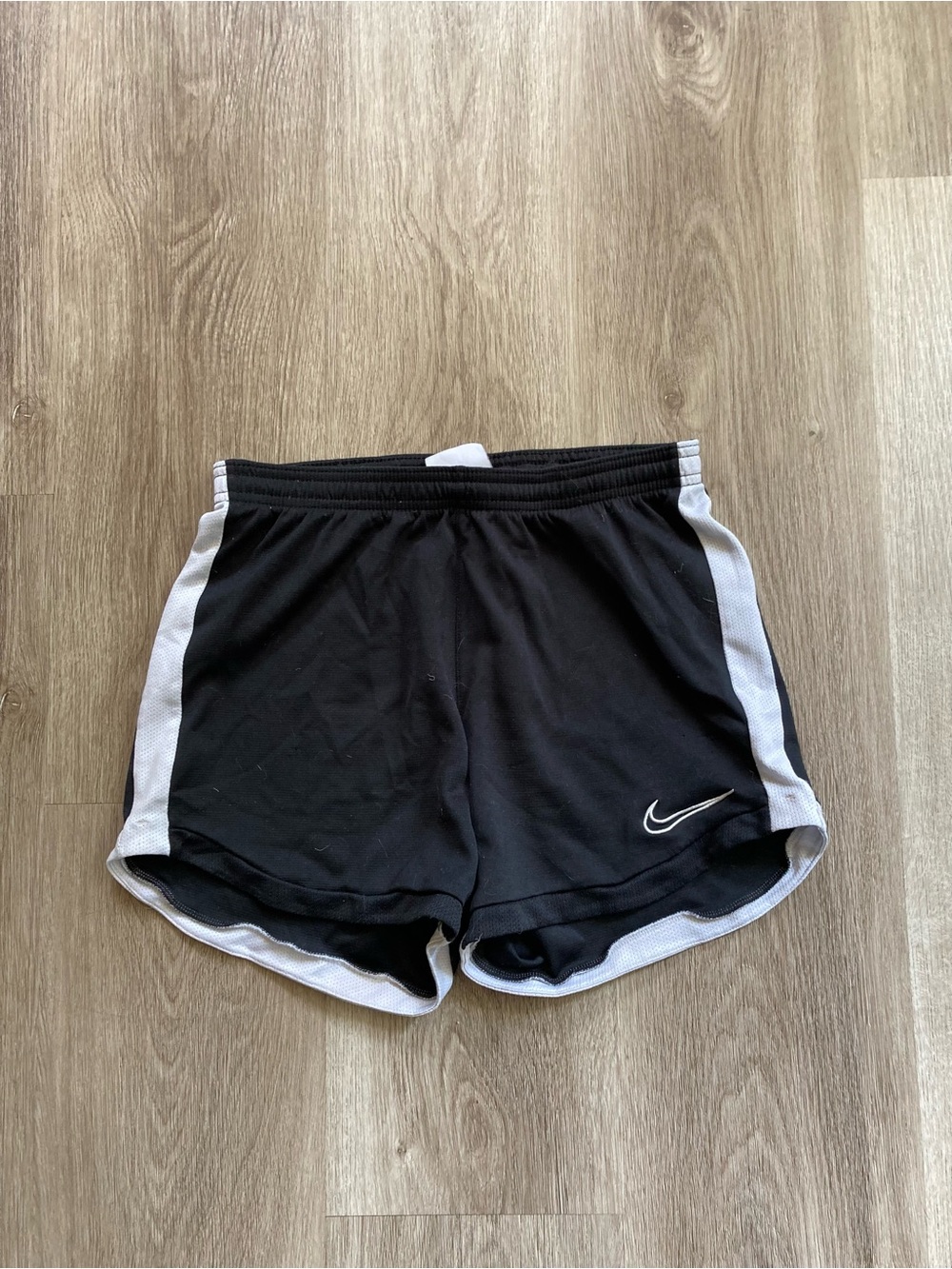 Nike Women’s Black Dolphin Athletic Shorts with White Side Panels